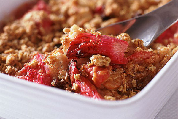 Apple and Rhubarb Crumble - This heart-warming dish will melt in your mouth. The sweet robust fruit topped with the crisp golden crumble will satisfy your every desire!